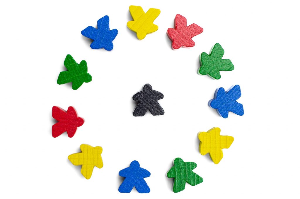 Leader in a centre of a circle of motivated group of people on a white background. Connecting people
